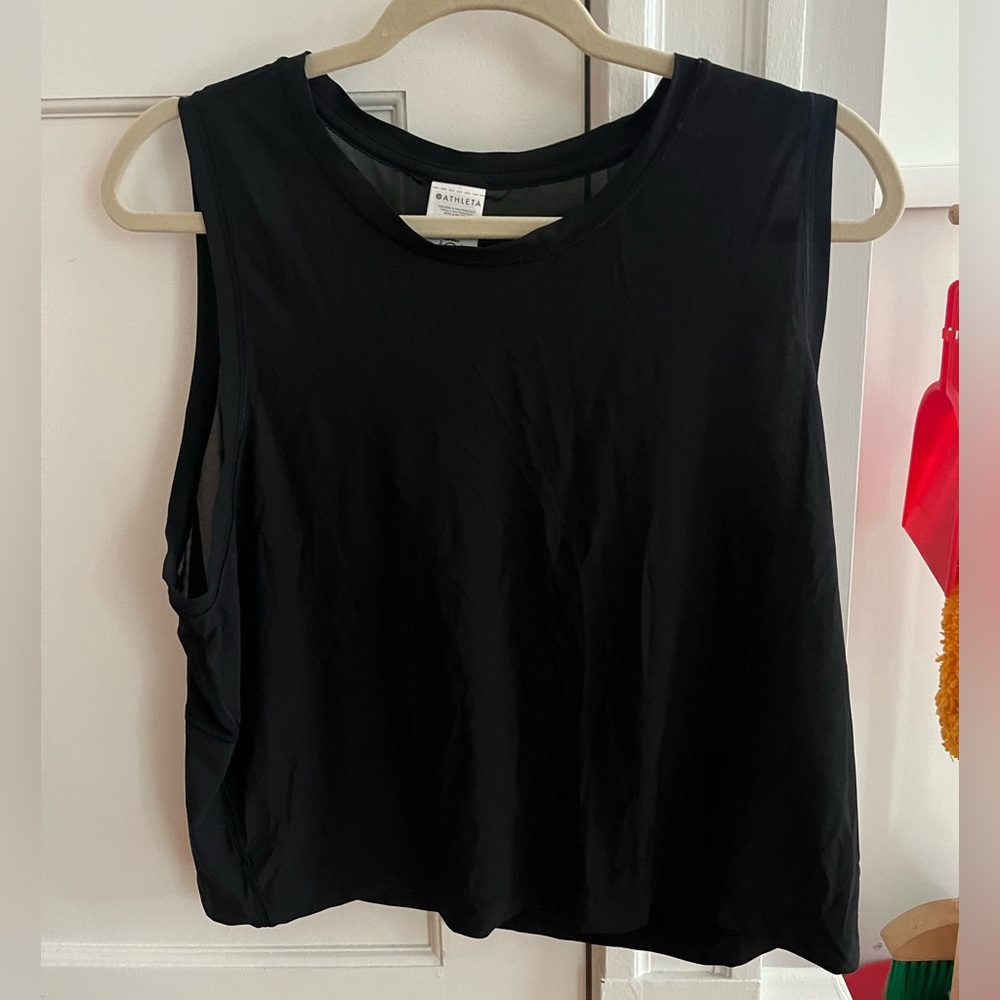 Athleta ultimate muscle tank.  Size large in color black. Mesh on upper back.